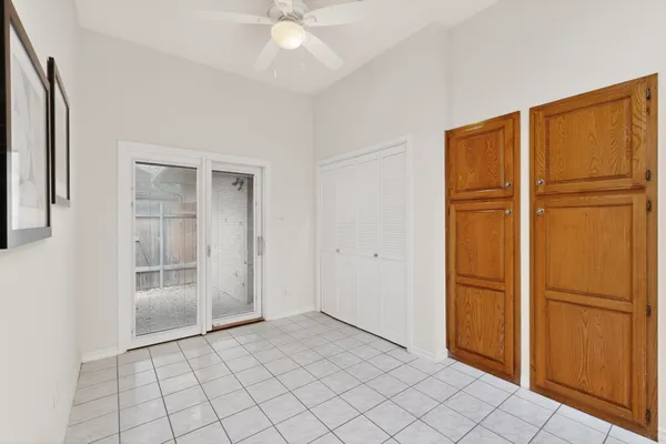 a view of an empty room with closet area