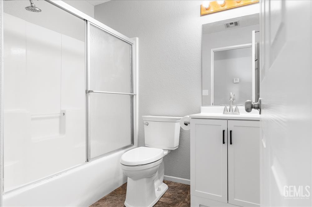 Undisclosed Address Tehachapi, CA 93561 - Photo 11 of 32 a bathroom with a sink a toilet and shower