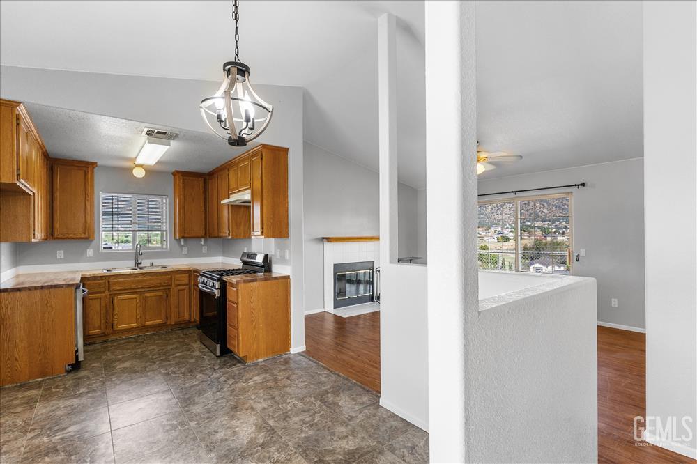 Undisclosed Address Tehachapi, CA 93561 - Photo 3 of 32 a kitchen with stainless steel appliances granite countertop a sink and stove