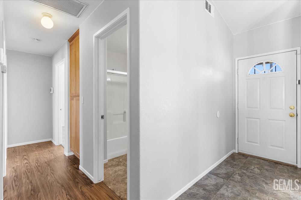Undisclosed Address Tehachapi, CA 93561 - Photo 10 of 32 a view of a hallway with wooden floor