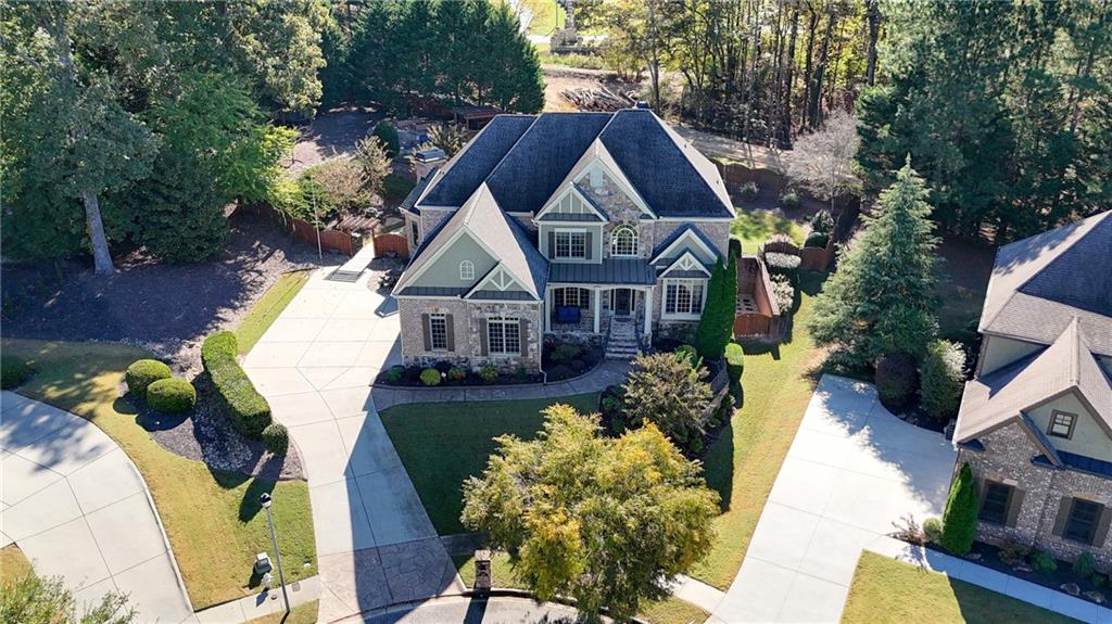 3302 Anna Ruby Lane Northeast Buford, GA 30519 - Photo 2 of 67 a front view of house with yard and trees around