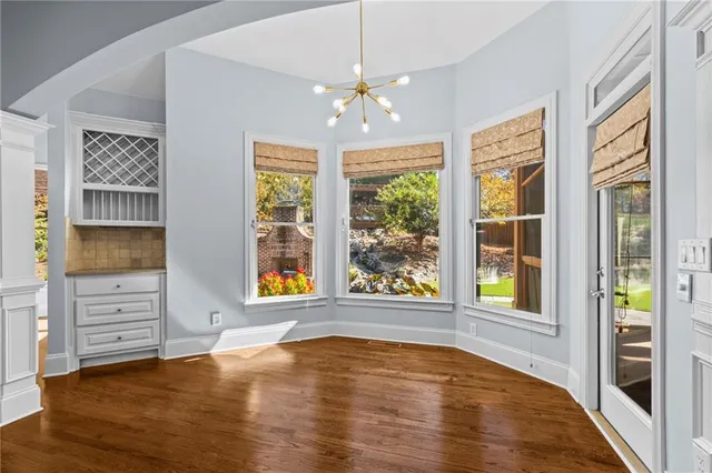 a white bath tub sitting next to a shower