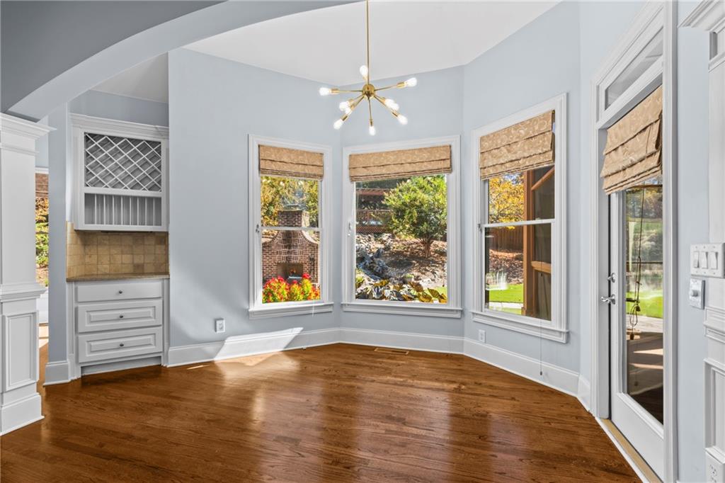 3302 Anna Ruby Lane Northeast Buford, GA 30519 - Photo 23 of 67 wooden floor in an empty room with a window