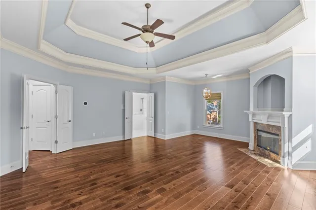 a spacious bathroom with a double vanity sink a large mirror and shower