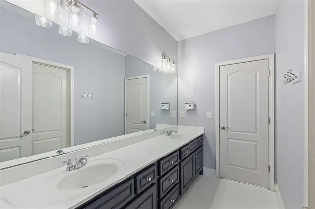 a view of a room with wooden floor and windows