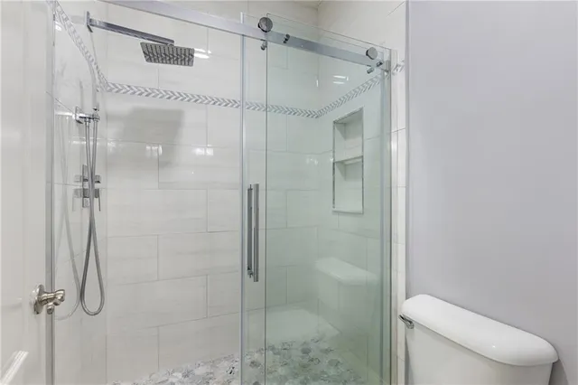 a view of brick wall and potted plants