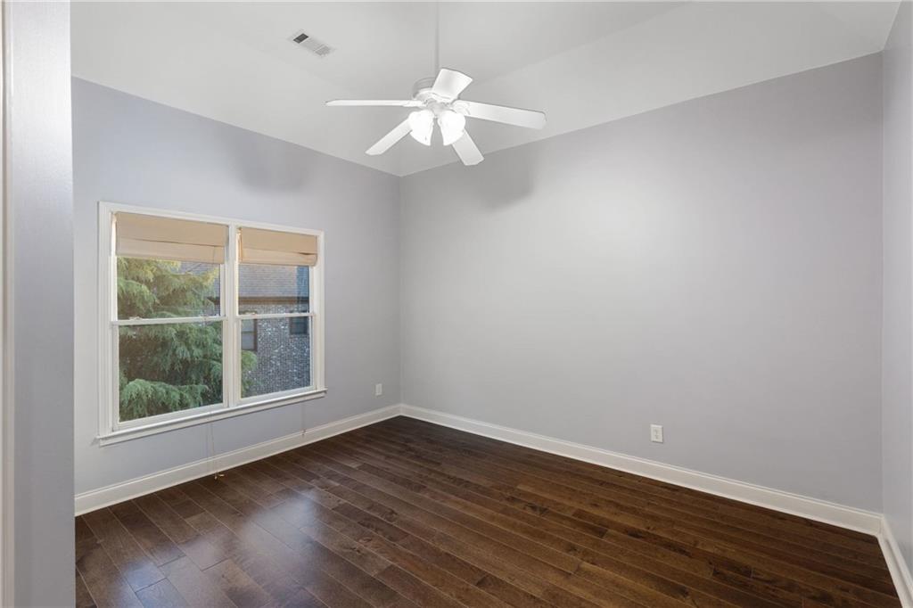 3302 Anna Ruby Lane Northeast Buford, GA 30519 - Photo 43 of 67 wooden floor in an empty room with a window