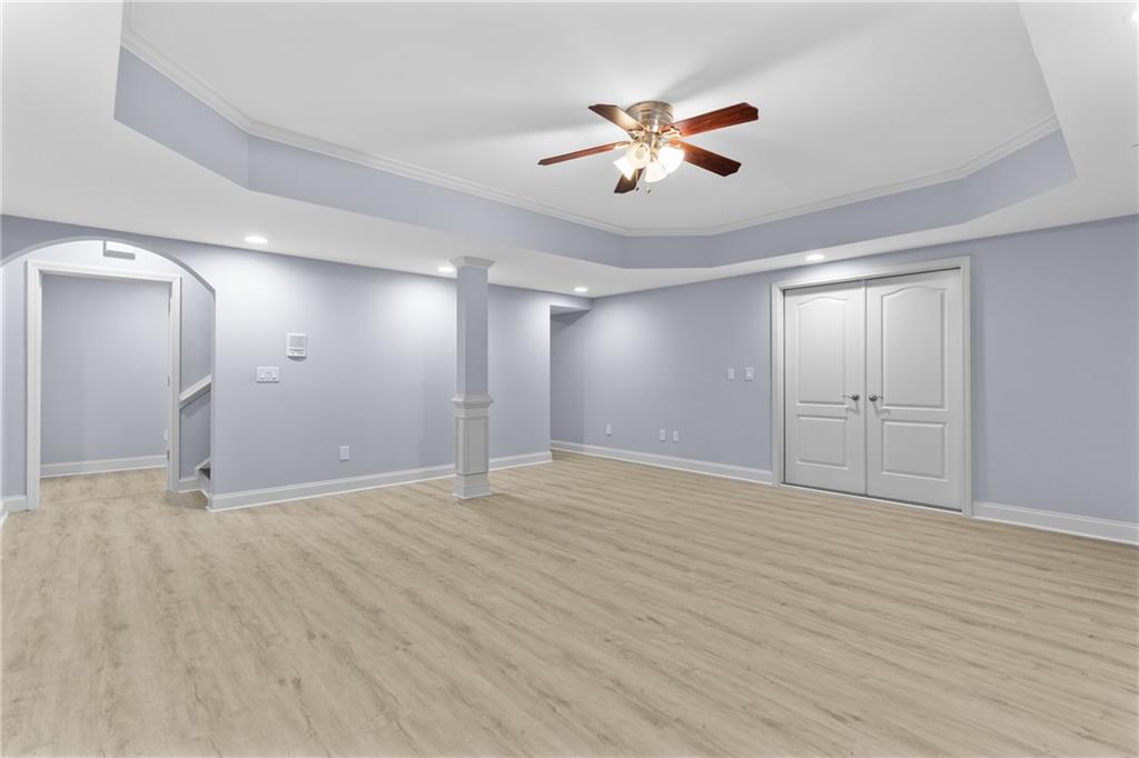 3302 Anna Ruby Lane Northeast Buford, GA 30519 - Photo 50 of 67 a view of an empty room with wooden floor