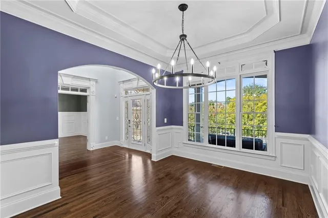 a kitchen with stainless steel appliances kitchen island wooden cabinets and granite counter tops