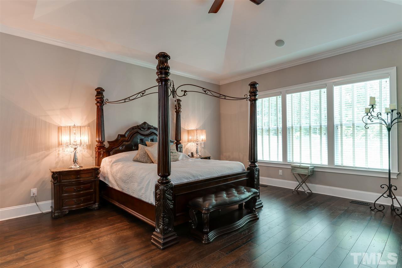 8105 Greys Landing Way Raleigh, NC 27615 - Photo 13 of 30 a bedroom with a bed a window and couch