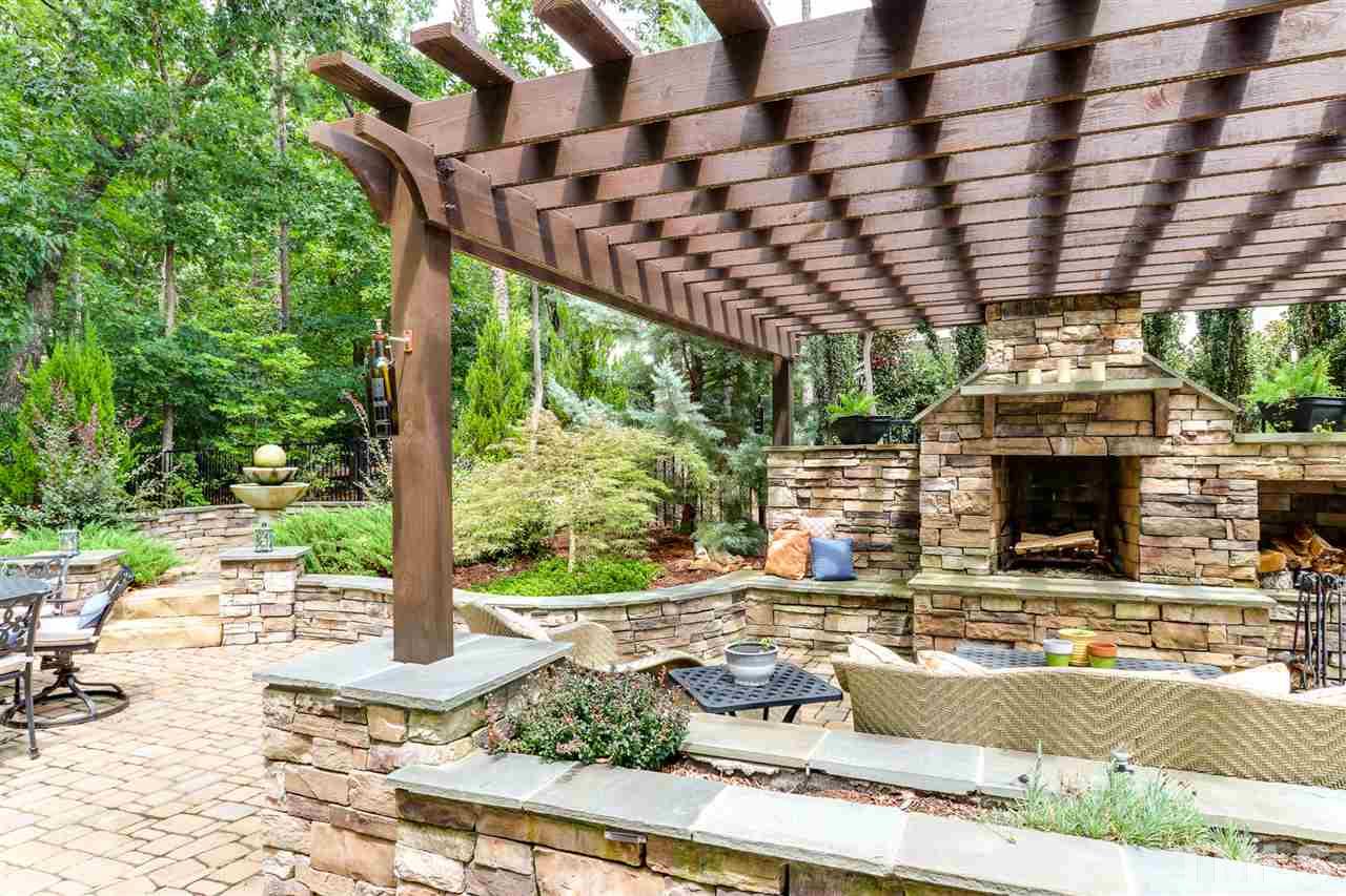 8105 Greys Landing Way Raleigh, NC 27615 - Photo 27 of 30 a building outdoor space with patio furniture and potted plants