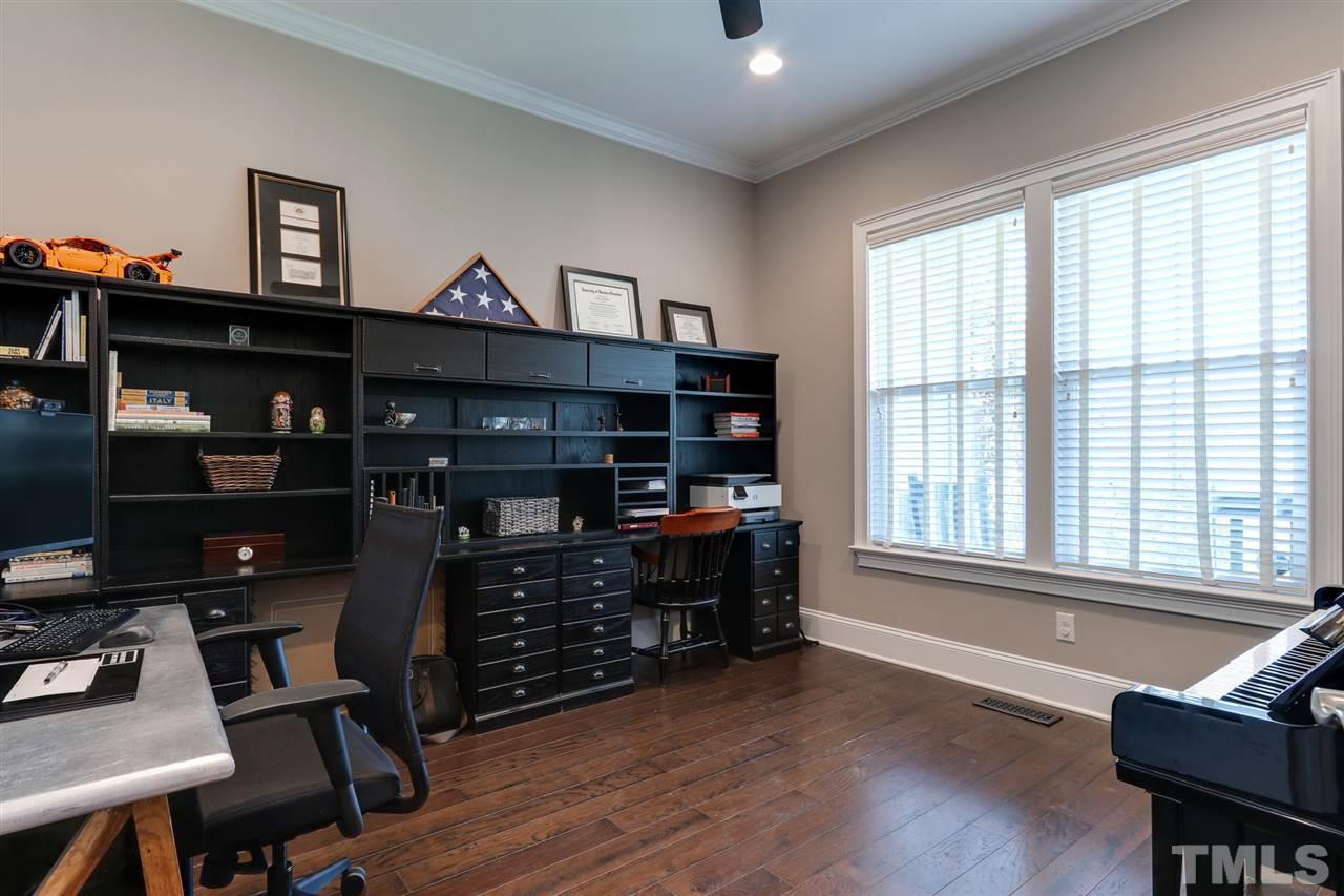 8105 Greys Landing Way Raleigh, NC 27615 - Photo 4 of 30 a living room with furniture a window and wooden floor