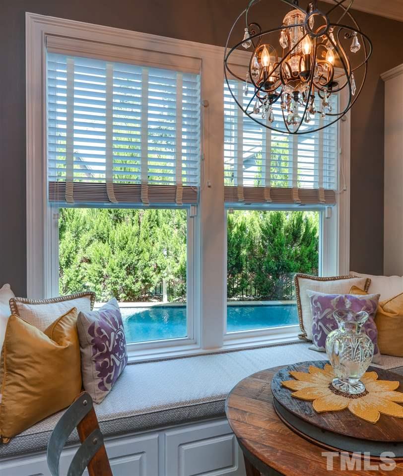 8105 Greys Landing Way Raleigh, NC 27615 - Photo 10 of 30 a view of a dining room with furniture window and outside view