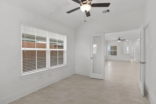 a view of an empty room with a window