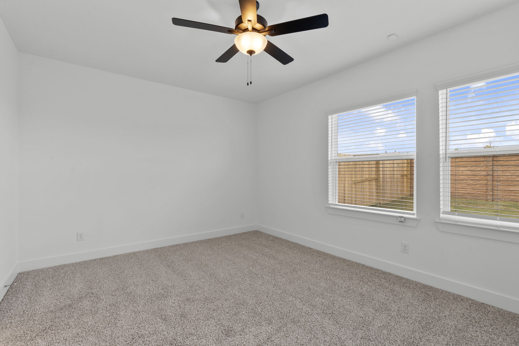 5231 Celestial Court Iowa Colony, TX 77583 - Photo 20 of 37 an empty room with a window and a fan