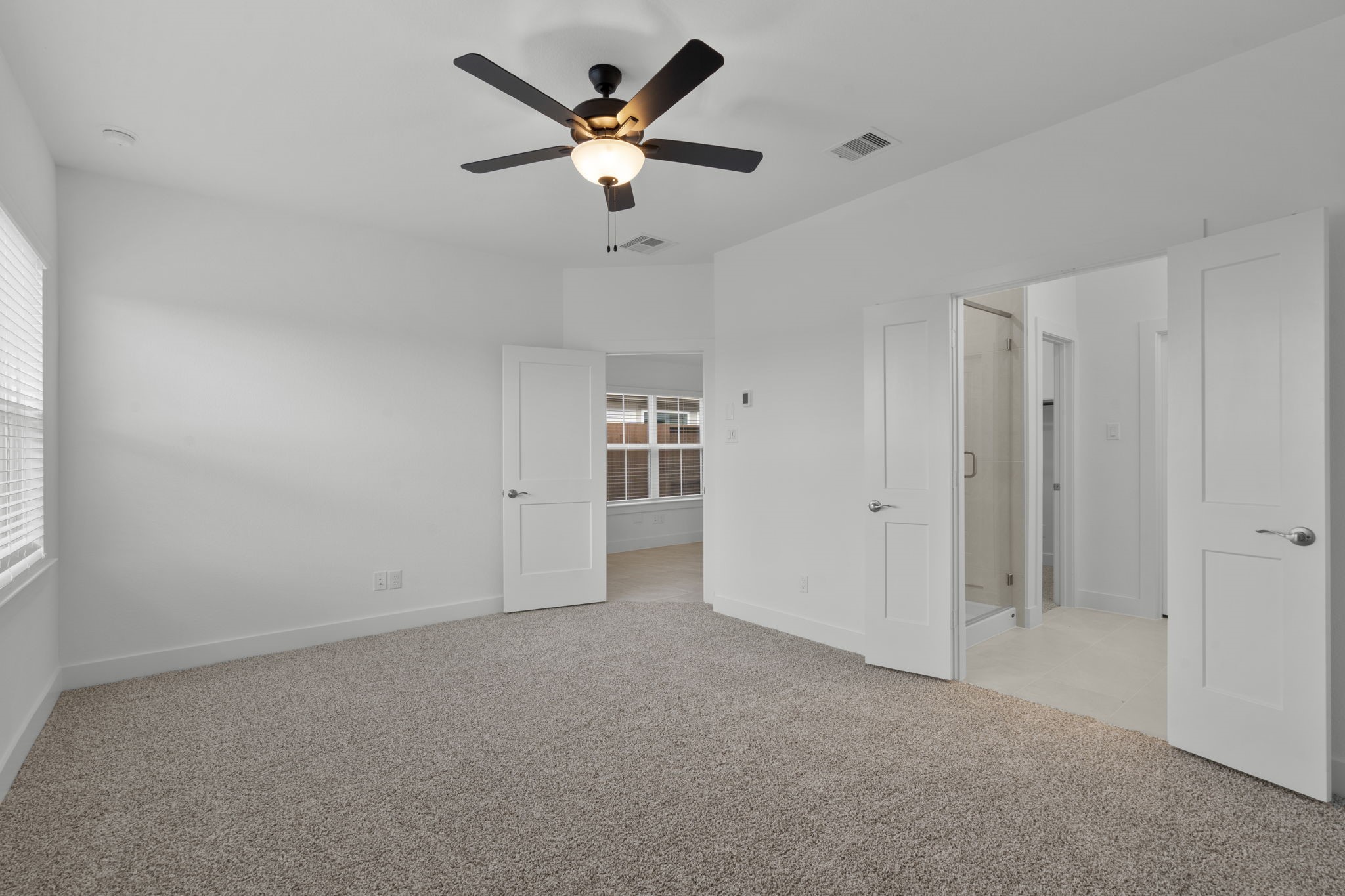 5231 Celestial Court Iowa Colony, TX 77583 - Photo 21 of 37 an empty room with chandelier fan and windows