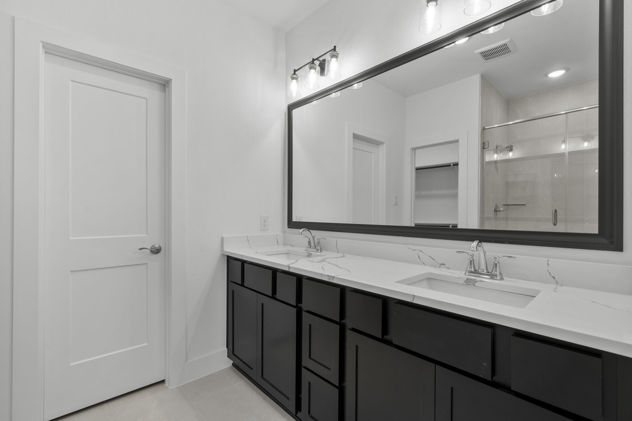 5231 Celestial Court Iowa Colony, TX 77583 - Photo 22 of 37 a bathroom with a double vanity sink and a mirror