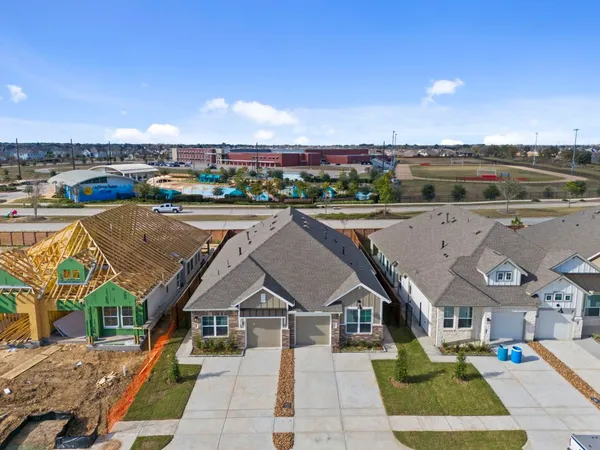 a view of a city with an outdoor space and seating area
