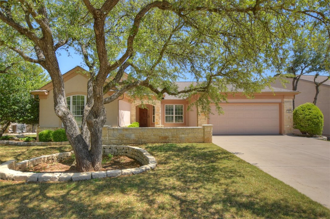 203 Summit Street Georgetown, TX 78633 - Photo 1 of 1 The live oaks overlook a large, walled flagstone patio and provide extra appeal to the entrance of this Coronado plan home.