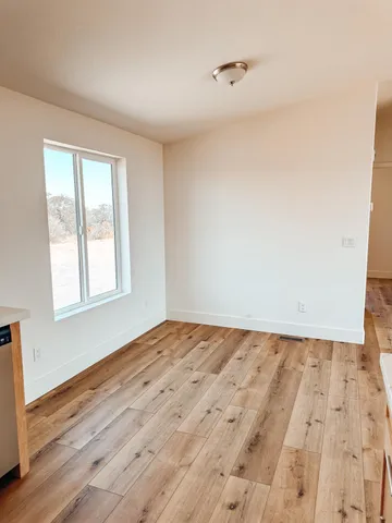 a view of an empty room and window