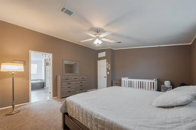 a spacious bathroom with a granite countertop sink and a bathtub