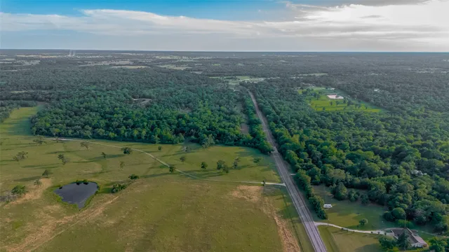 a view of a lake with a yard