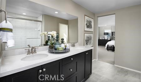 2102 East Jackman Street Lancaster, CA 93535 - Photo 4 of 5 a bathroom with a sink double vanity and a mirror