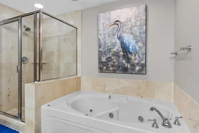 a bathroom with a bathtub and shower