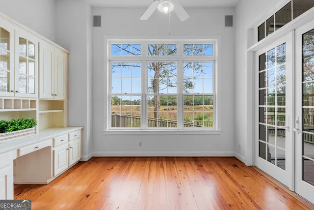 a view of an entryway with wooden floor and stairs