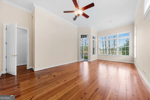 a view of balcony with deck and wooden floor