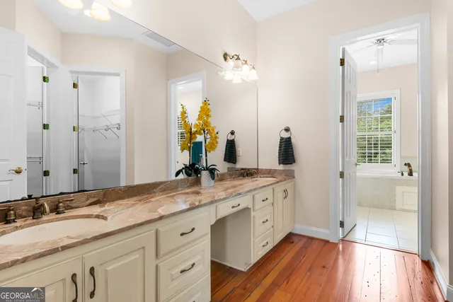 an aerial view of residential houses with outdoor space and swimming pool