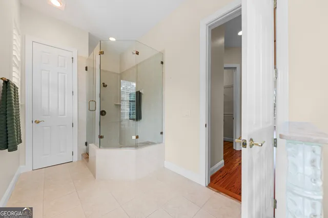 a view of a house with a street lush green forest