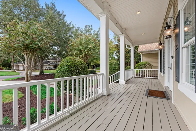 a kitchen with granite countertop white cabinets white stainless steel appliances and a granite counter tops