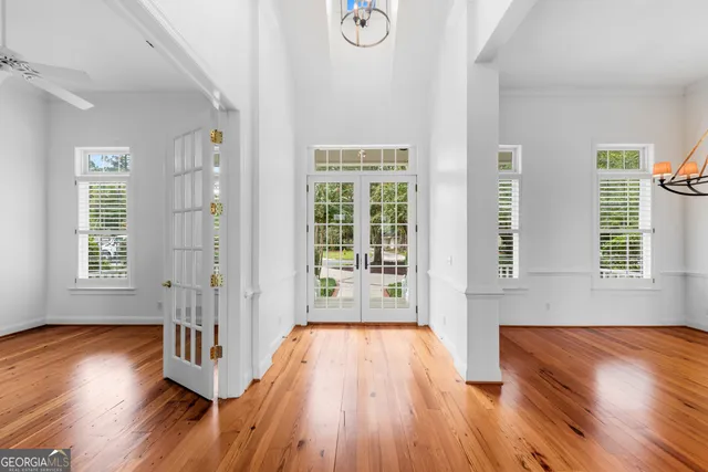a kitchen with granite countertop a sink a counter space appliances and cabinets