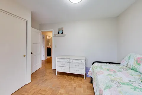 a bedroom with a bed and a cabinets