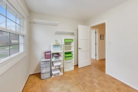 a view of a bedroom with a furniture and closet