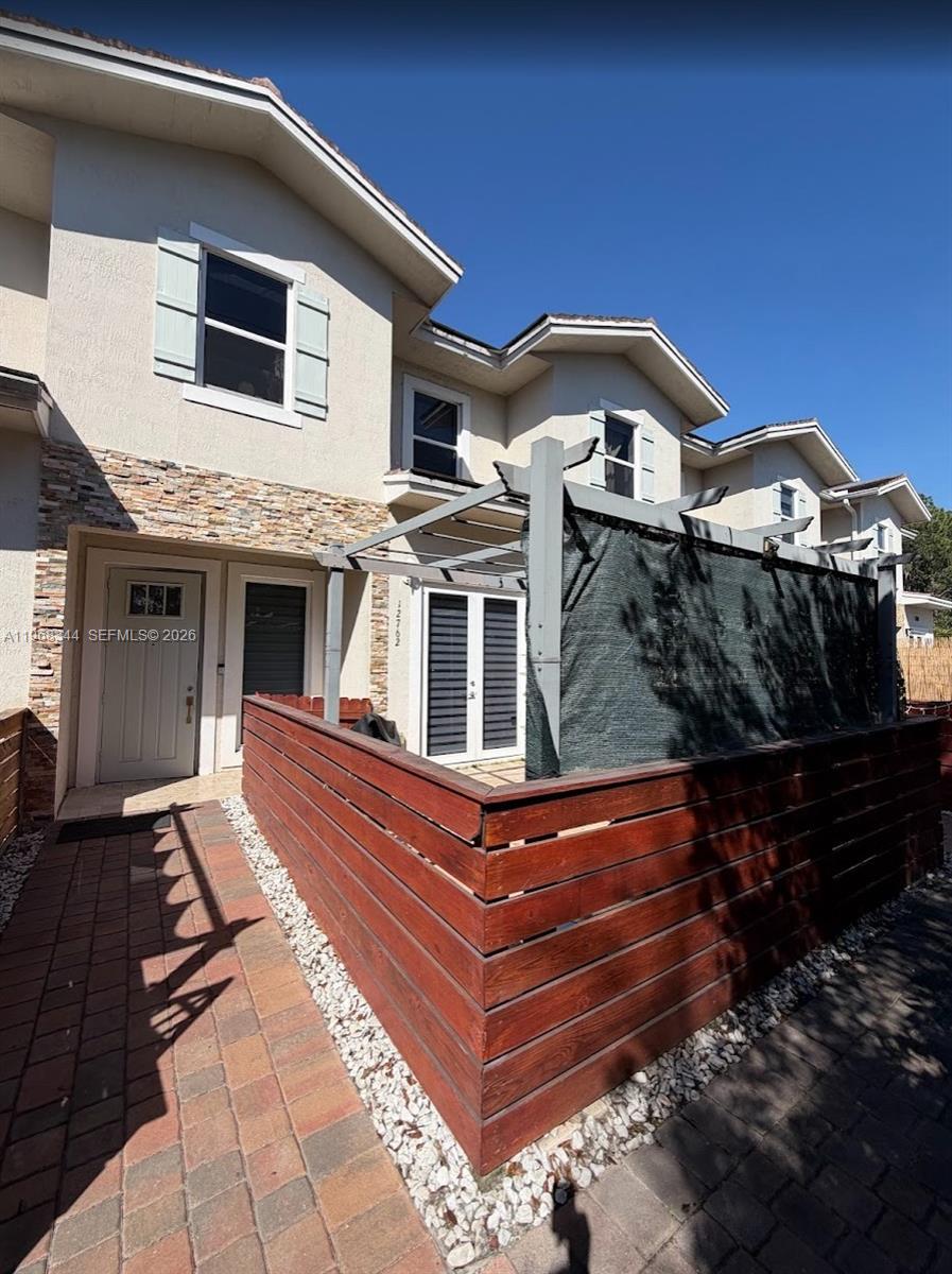 12762 Southwest 248th Street Homestead, FL 33032 - Photo 16 of 17 a view of a house with a large window and wooden floor
