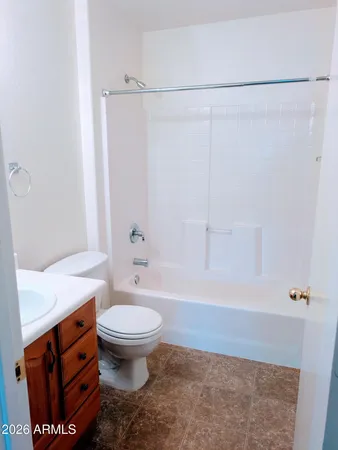 a bathroom with a sink a toilet and a shower