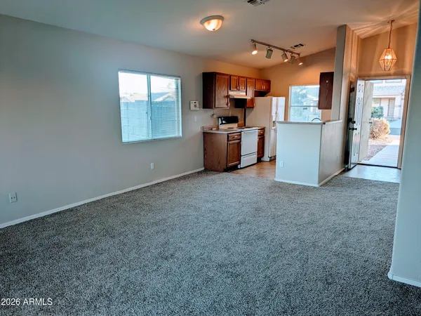 a kitchen with stainless steel appliances a refrigerator and a microwave