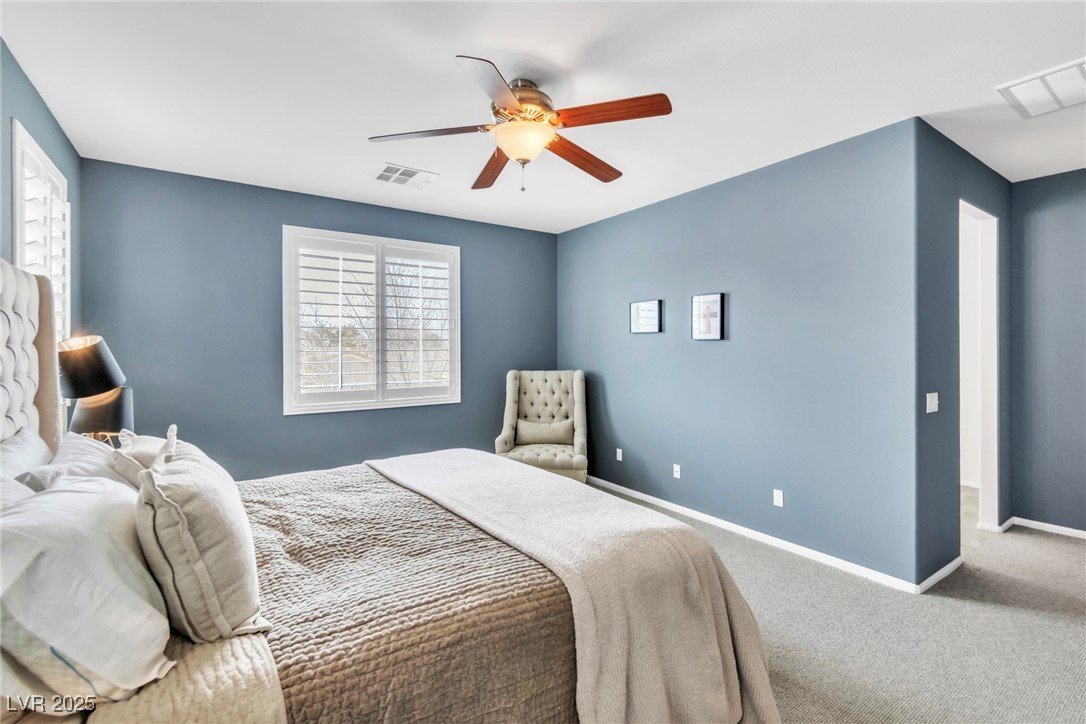 10350 Mystic Pine Road Las Vegas, NV 89135 - Photo 4 of 43 Bedroom with ceiling fan, carpet floors, visible v