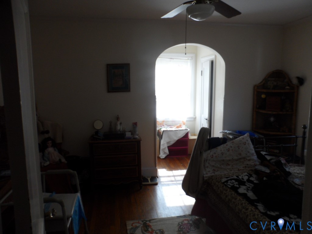 1716 Maple Shade Lane Richmond, VA 23227 - Photo 11 of 14 a bedroom with a bed window and dresser