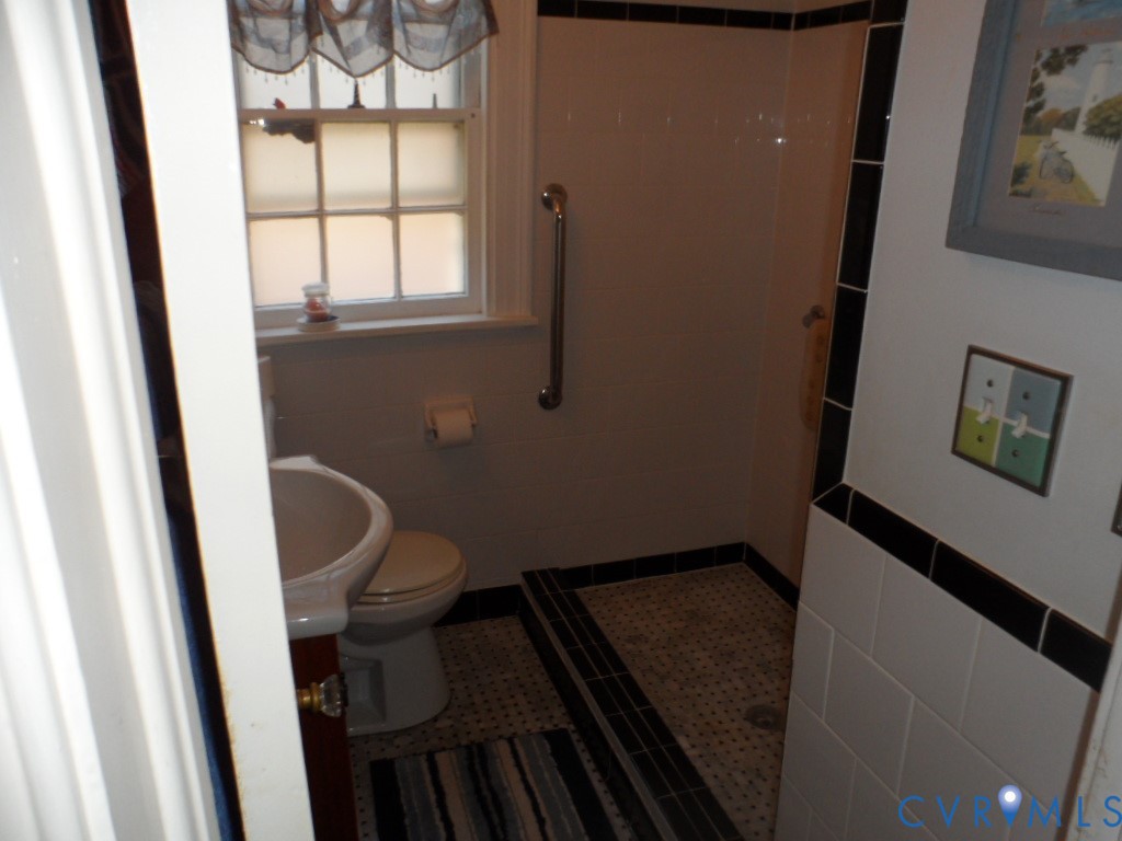 1716 Maple Shade Lane Richmond, VA 23227 - Photo 12 of 14 a bathroom with a toilet and a sink