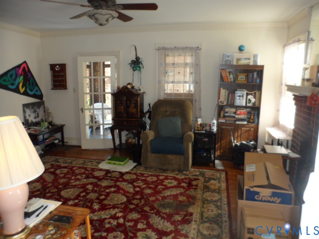 1716 Maple Shade Lane Richmond, VA 23227 - Photo 3 of 14 a living room with furniture a window and gym equipment