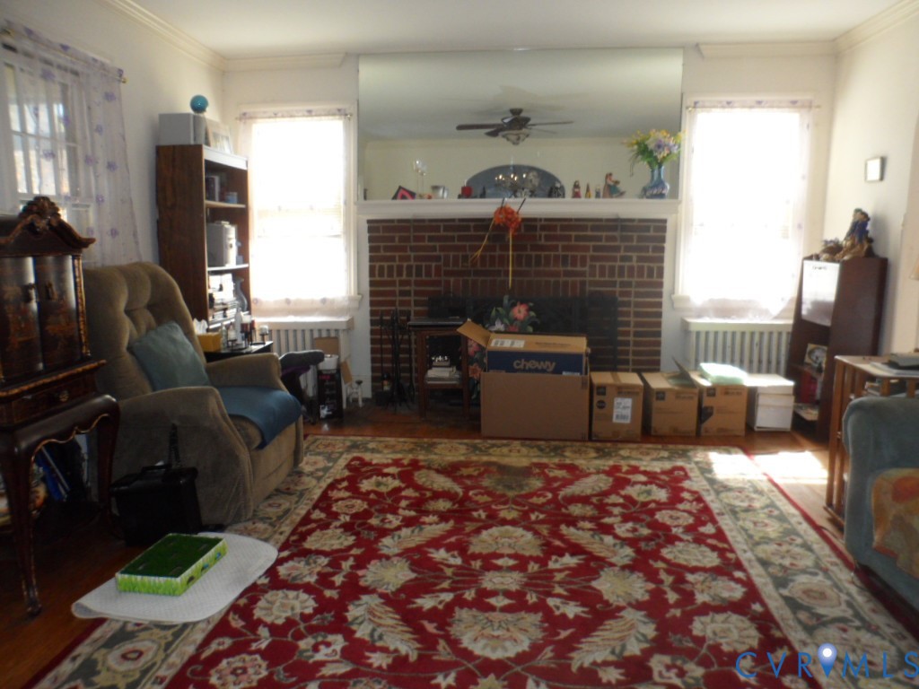 1716 Maple Shade Lane Richmond, VA 23227 - Photo 4 of 14 a living room with furniture rug and a fireplace