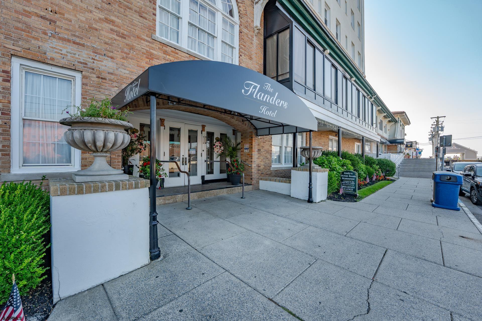 719 East 11th Street, Unit 510 Ocean City, NJ 08226 - Photo 2 of 16 a front view of a house with porch and seating space