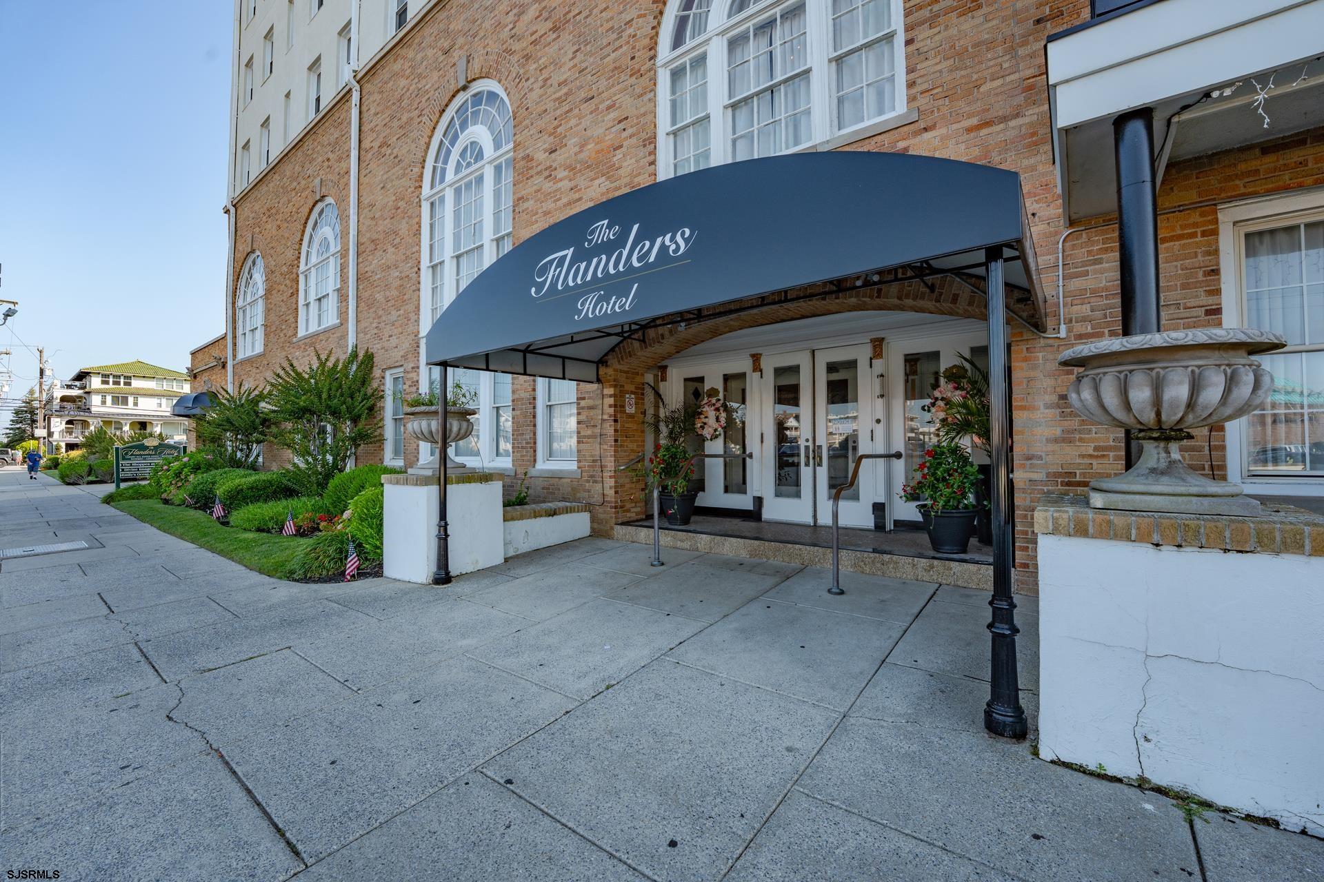 719 East 11th Street, Unit 510 Ocean City, NJ 08226 - Photo 3 of 16 a front view of a building with garden