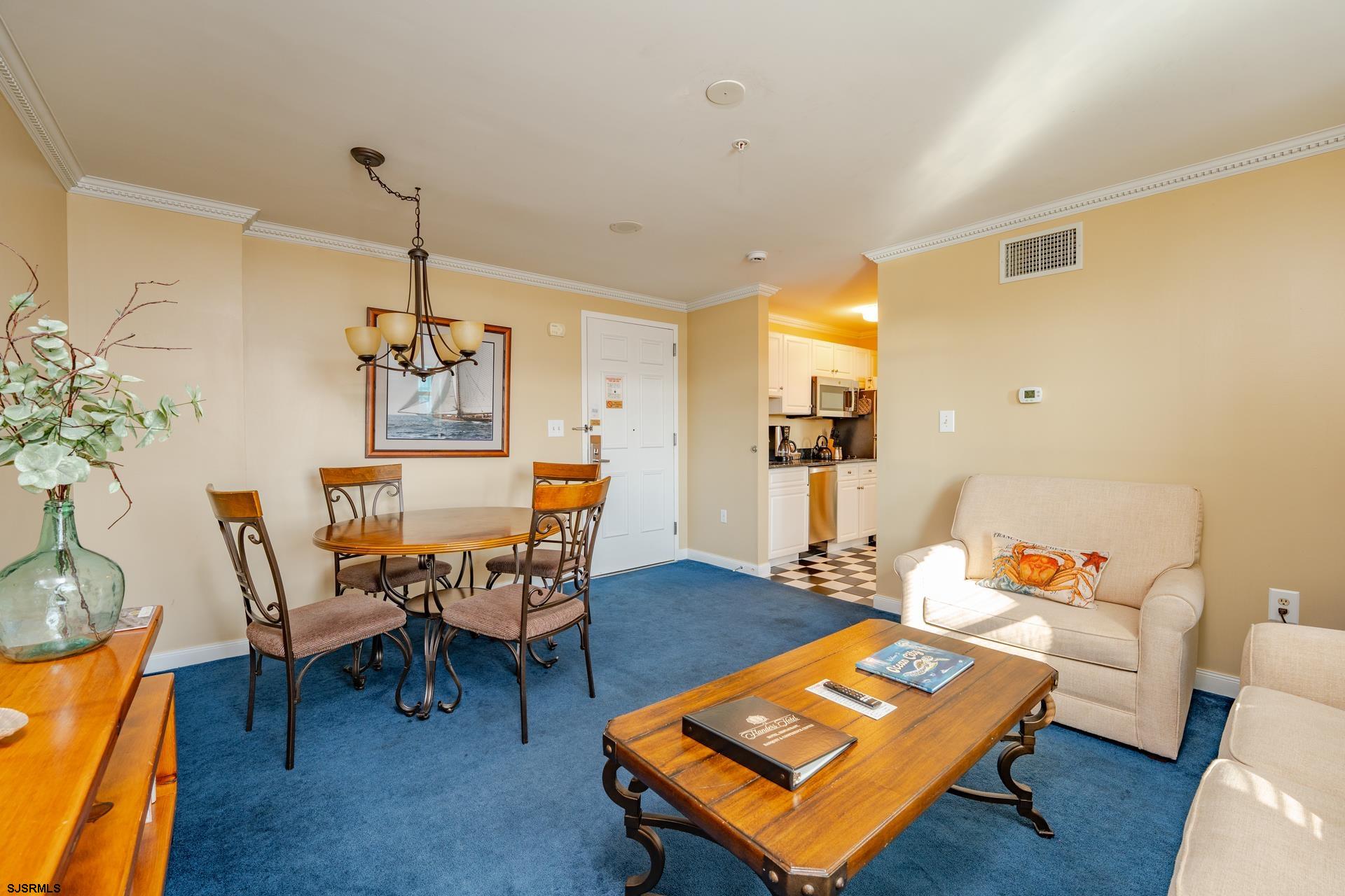 719 East 11th Street, Unit 510 Ocean City, NJ 08226 - Photo 9 of 16 a living room with furniture and wooden floor