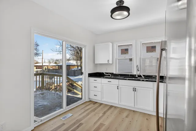 a kitchen with stainless steel appliances granite countertop a stove and a sink