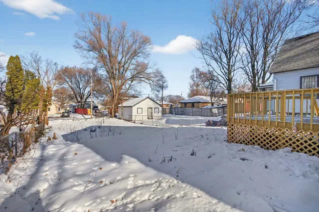 a view of a house with a snow in the yard