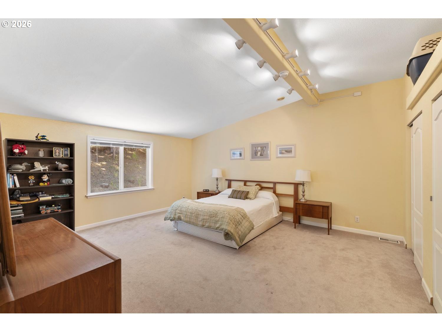 55279 Southwest Date Street Gaston, OR 97119 - Photo 28 of 45 a spacious bedroom with a bed and window